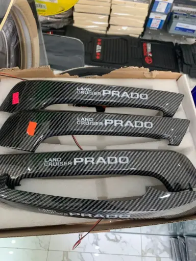 [POIGN-0001] POIGNET DE PORTIERE LC PRADO LED FIBRE DE CARBONNE 